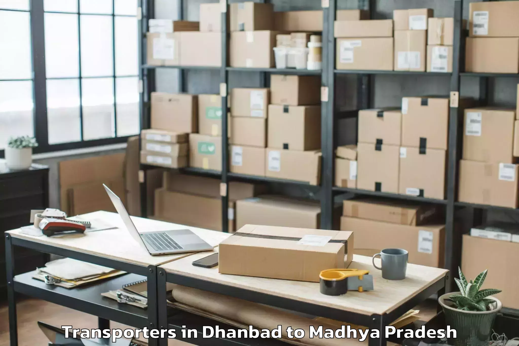 Book Dhanbad to Madhyanchal Professional Unive Transporters Online